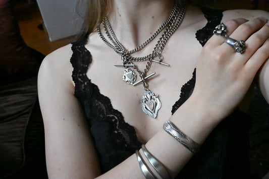 A sterling silver watch chain with T-bar, dog clip clasps and sports jewel, 42.4g