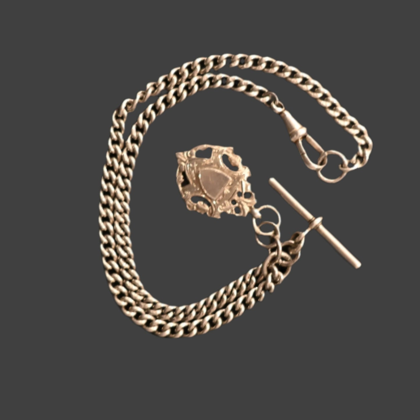 A sterling silver watch chain with T-bar, dog clip clasps and sports jewel, 42.4g